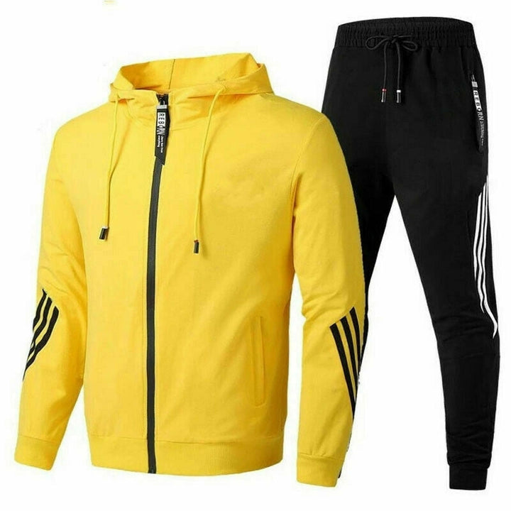 Moderne, grå træningsdragt af åndbart stof, perfekt til sport og fritid. Maksimal komfort og stil.