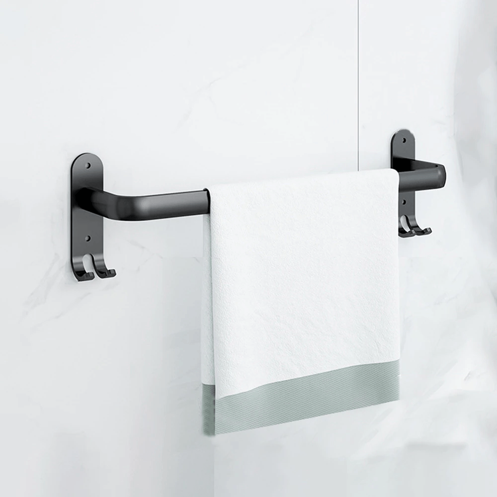 Moderne håndklædestativ i sort metal i et elegant design, ideel til stilfuld badeværelsesudsmykning.