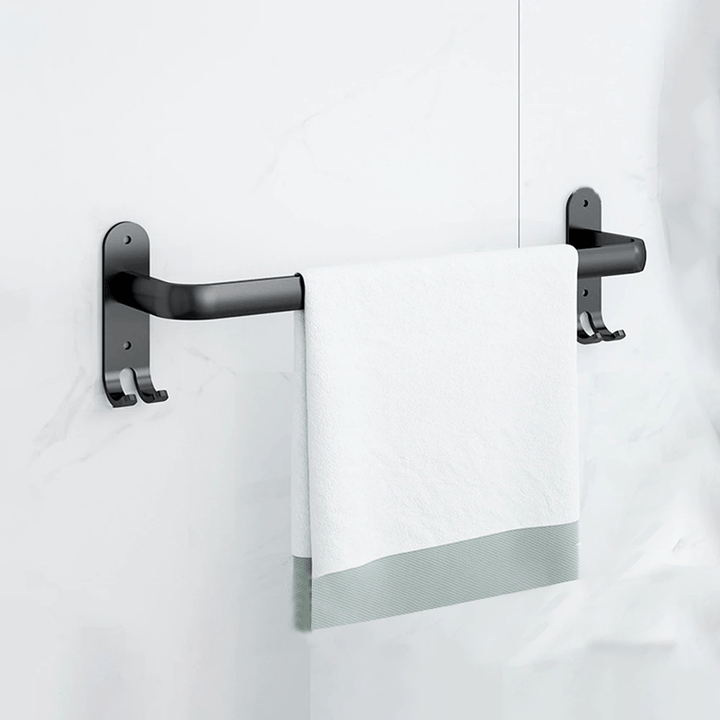 Moderne håndklædestativ i sort metal i et elegant design, ideel til stilfuld badeværelsesudsmykning.