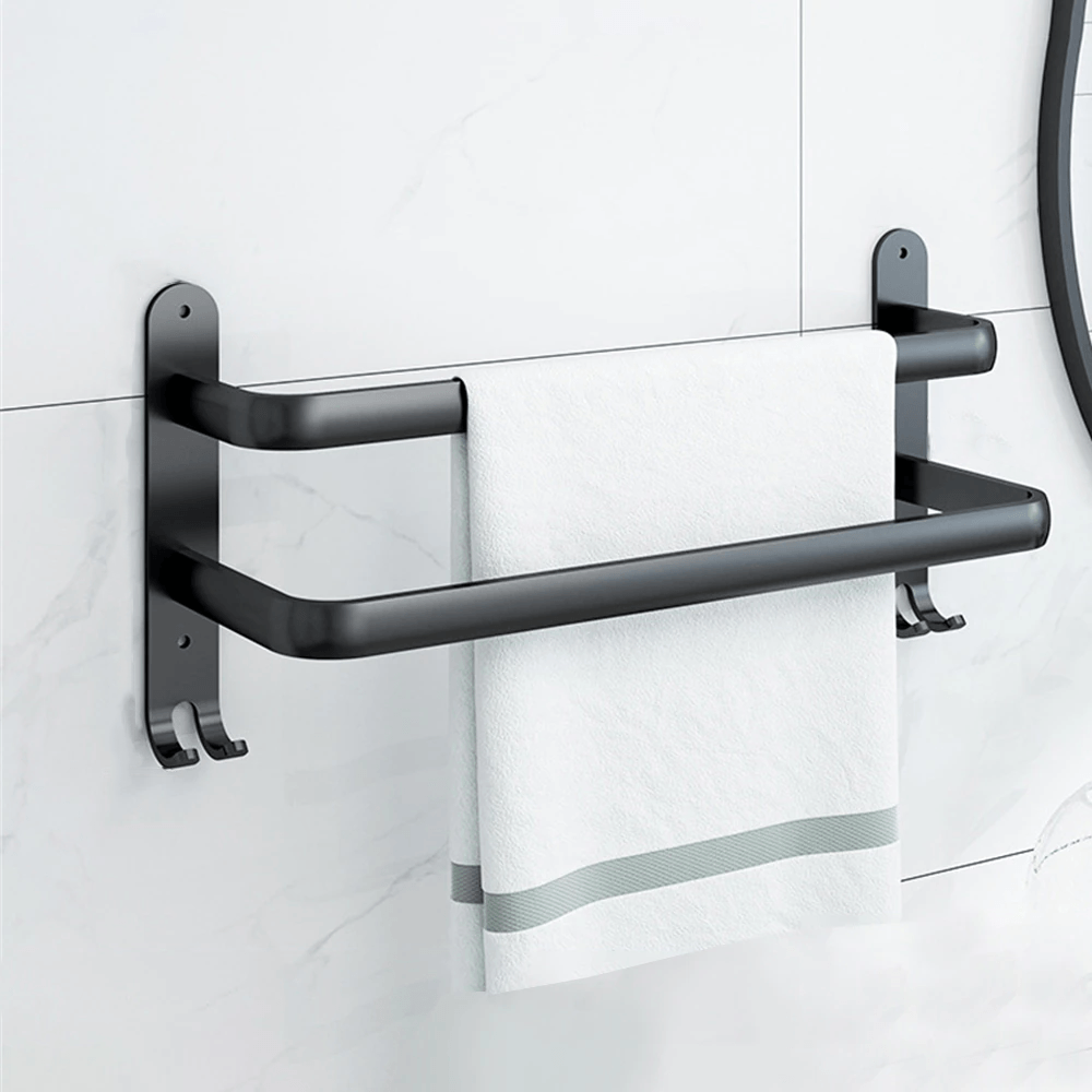 Moderne håndklædestativ i sort metal i et elegant design, ideel til stilfuld badeværelsesudsmykning.