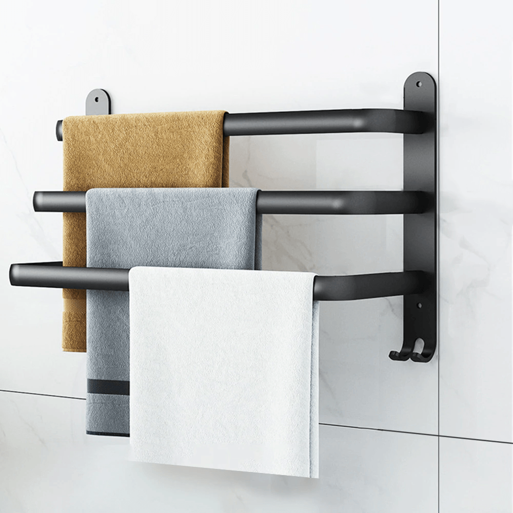 Moderne håndklædestativ i sort metal i et elegant design, ideel til stilfuld badeværelsesudsmykning.