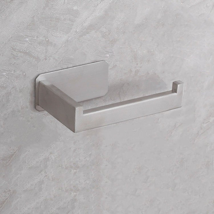 Detaljeret visning af moderne toiletpapirholder i rustfrit stål, borefrit design, elegant, i sølv eller sort, til ethvert badeværelse.