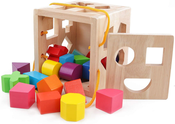 Montessori læringsterning i træ med farverige klodser i former som trekanter og cirkler, ideel til tidlig barndomsudvikling.