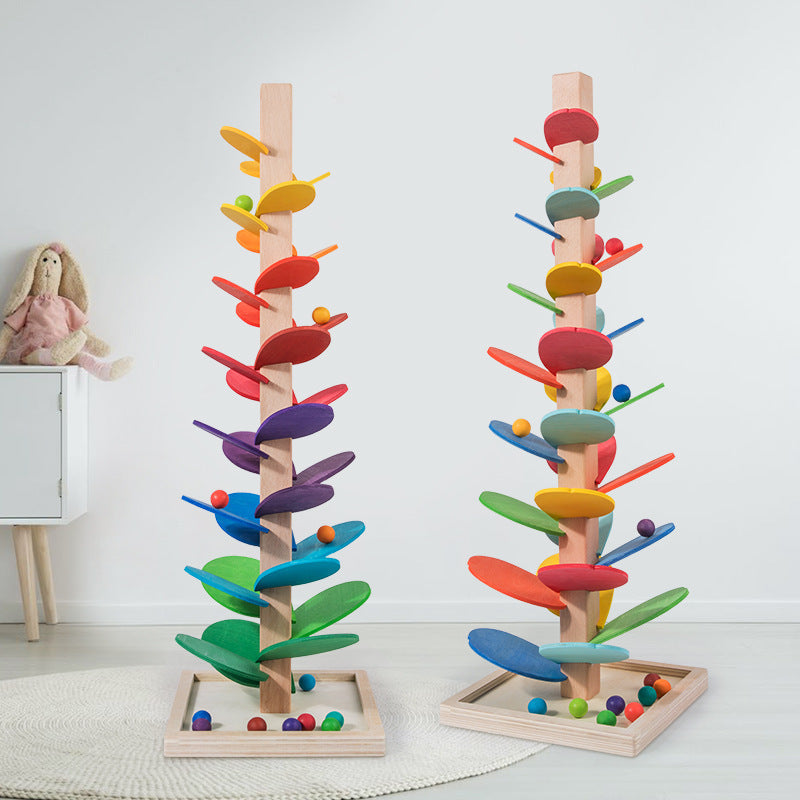 Montessori Regnbue Træmarmortårn: Farverigt legetøj med rullende marmorkugler, der fremmer motorisk udvikling.