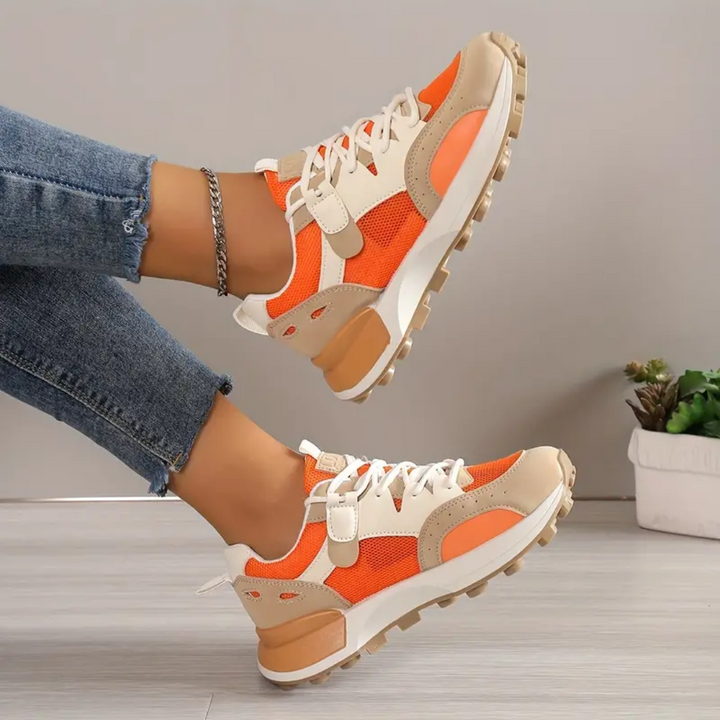Stilfulde orange casualsko for kvinder, ideelle sommersko. Komfortable damesneakers med åndbart design.