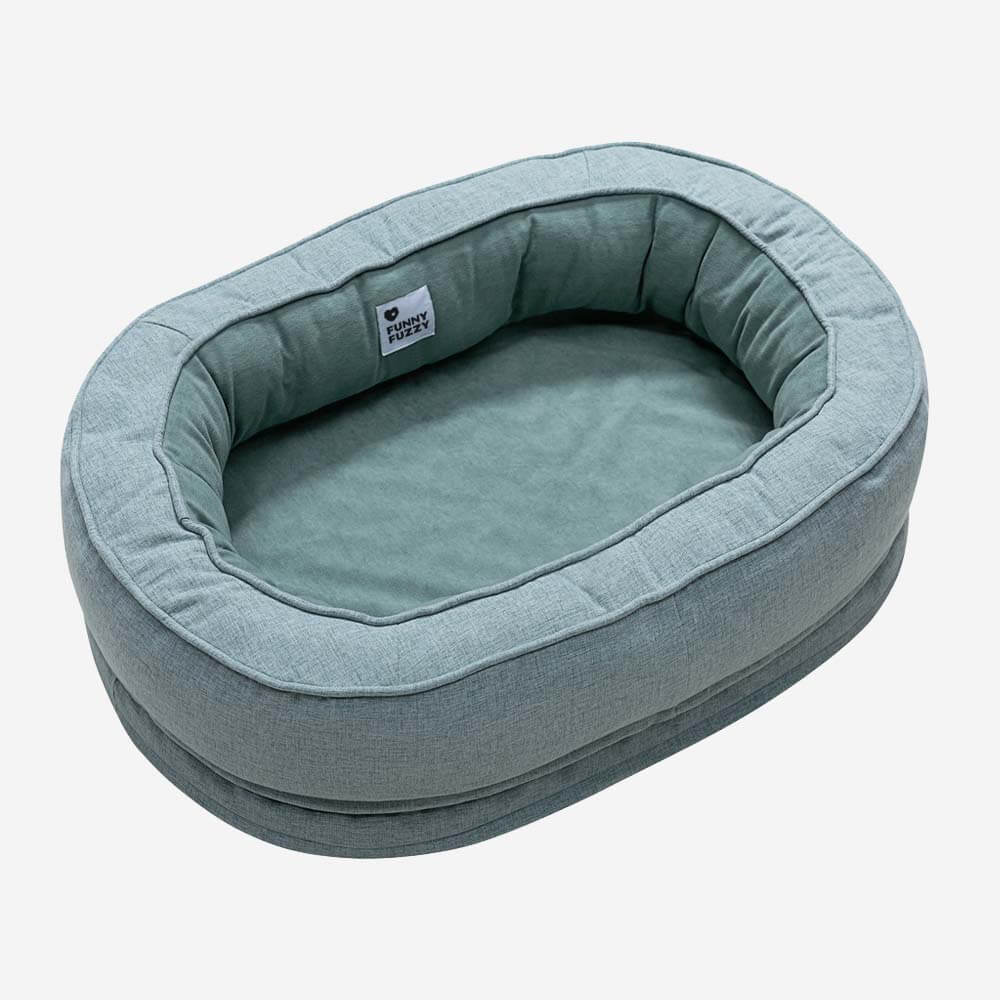 "Orthopädisches flauschiges Haustierbett in Donutform, beige, für Hunde, bietet Komfort und Unterstützung auf glatten Böden."