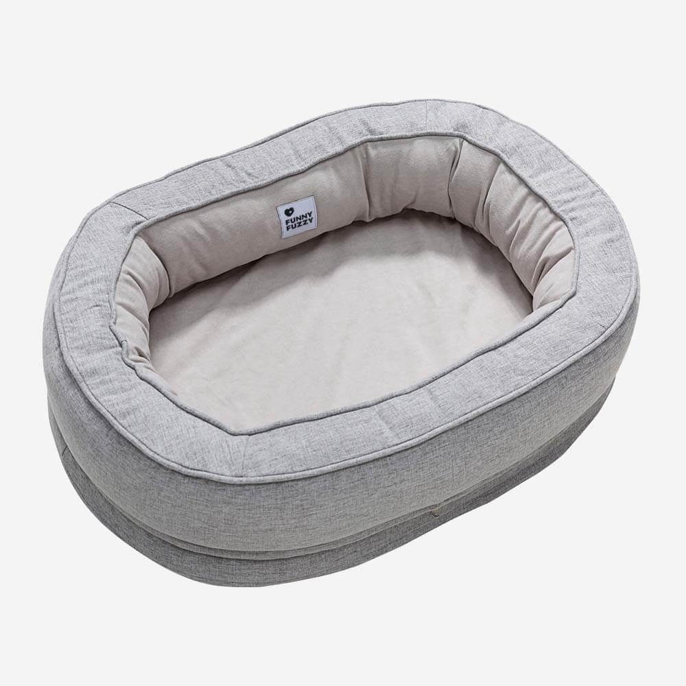 "Orthopädisches flauschiges Haustierbett in Donutform, beige, für Hunde, bietet Komfort und Unterstützung auf glatten Böden."