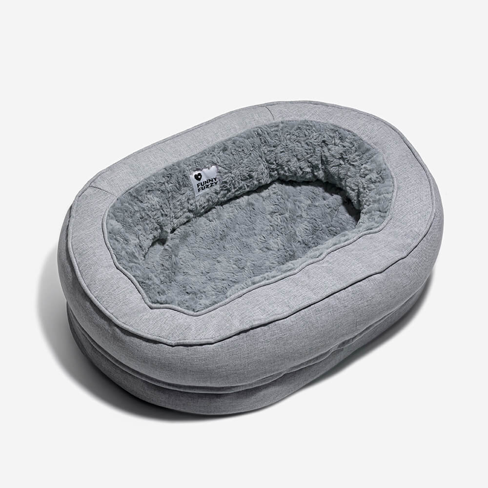 "Orthopädisches flauschiges Haustierbett in Donutform, beige, für Hunde, bietet Komfort und Unterstützung auf glatten Böden."