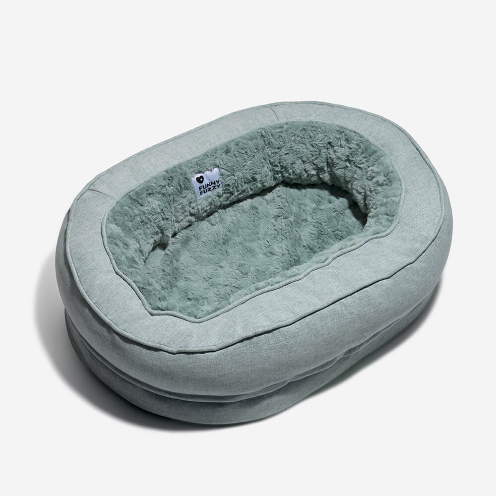 Ortopædisk fluffy kæledyrsseng i donutform, beige, til hunde, tilbyder komfort og støtte på glatte gulve.