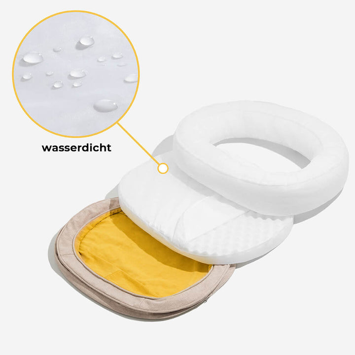 Ortopædisk fluffy kæledyrsseng i donutform, beige, til hunde, tilbyder komfort og støtte på glatte gulve.