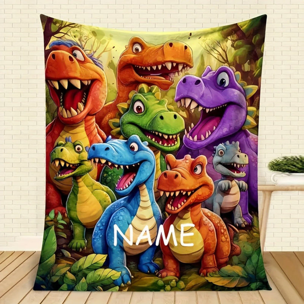 Nærbillede af et personligt dinosaur børnetæppe med et unikt navn trykt på. Ideel gave til børn.