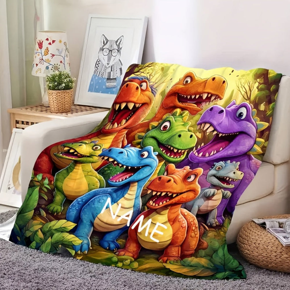 Blødt flonel børnetæppe med dinosaurer og personligt navn. Et hyggeligt tæppe, der er den perfekte gave til børn.