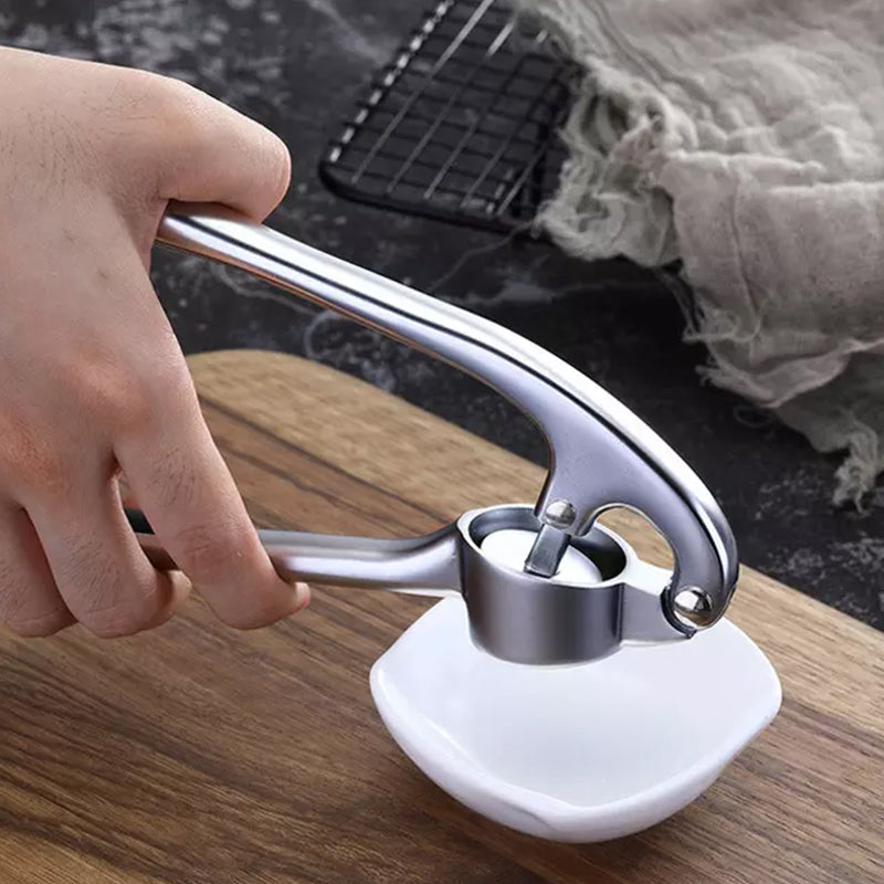 Premium hvidløgspresser i rustfrit stål, robust, ergonomisk, ubesværet hvidløgsknusning, ideel køkkenhjælp.