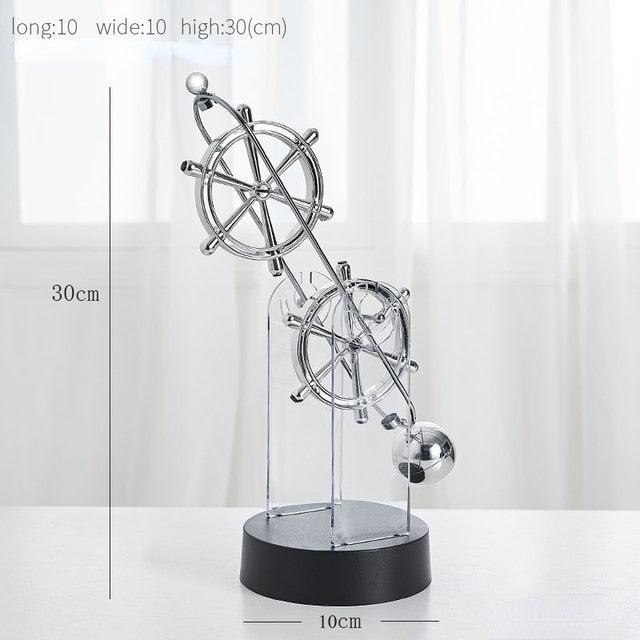 Roterende evighedspendel, dekorativt ornament med elegant dobbelt-trippelring design, lydløst og hypnotisk.