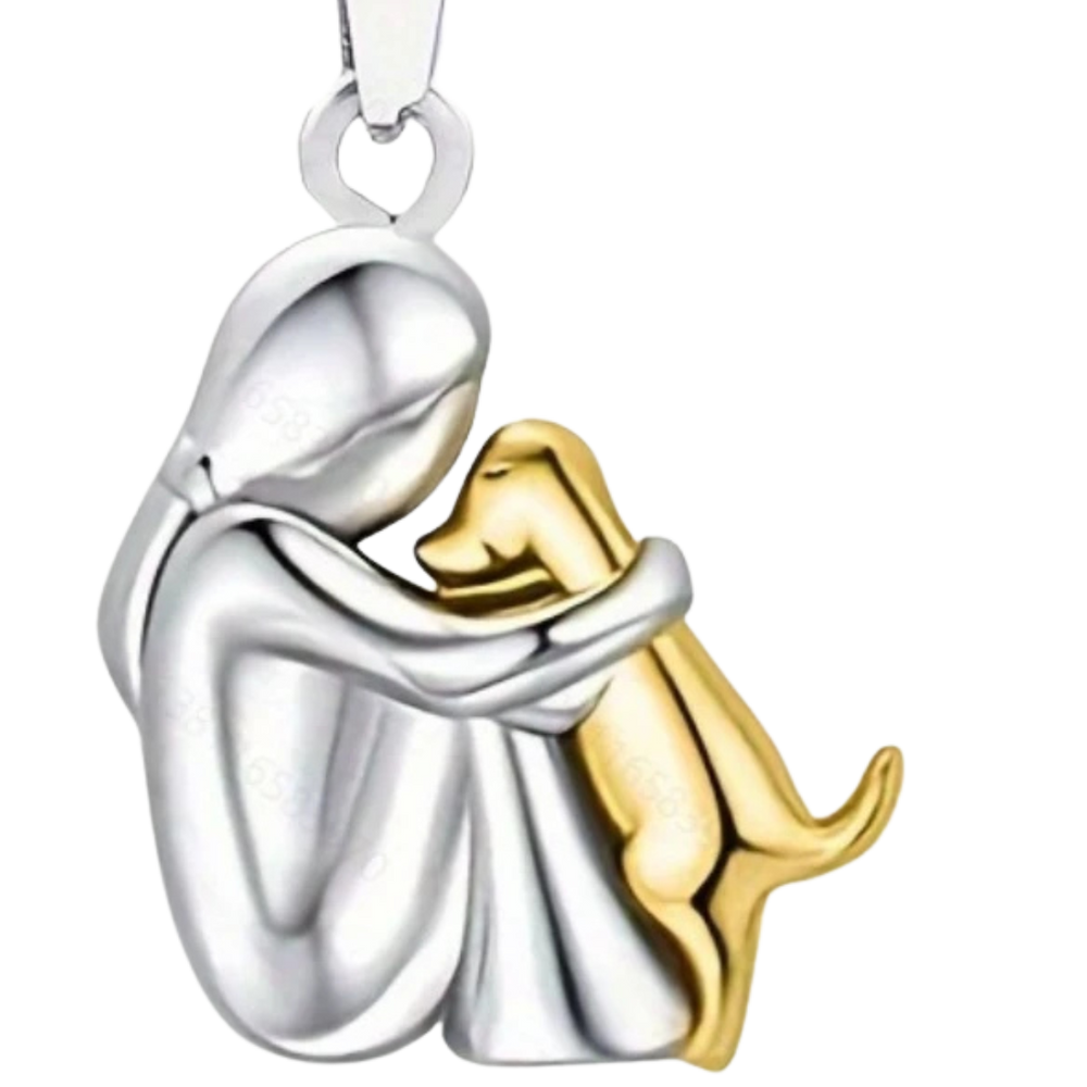 Elegant kvinders halskæde i guld med hundekram, viser loyalitet og venskab mellem menneske og hund.
