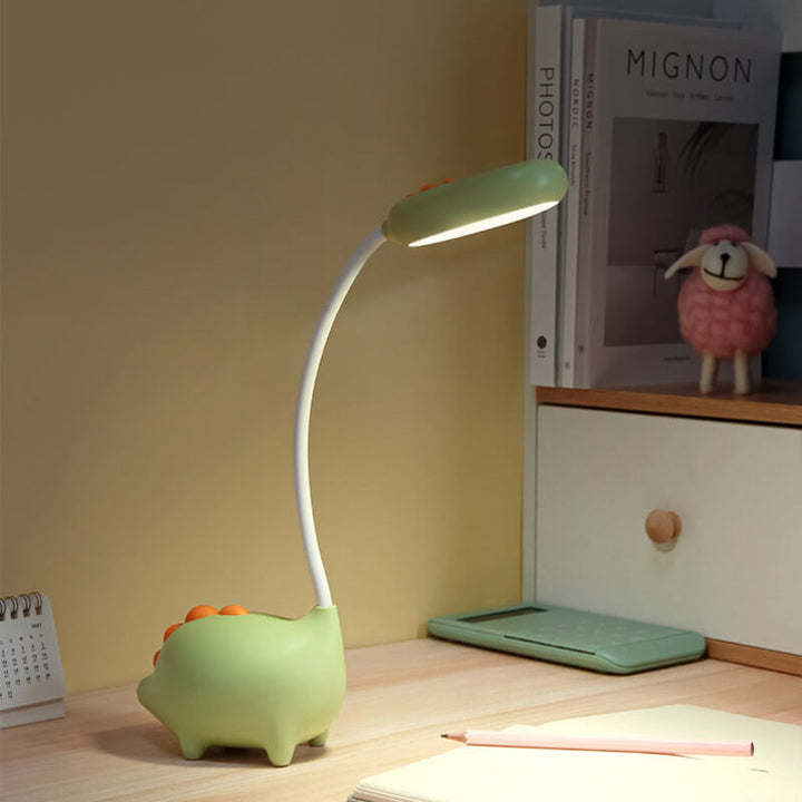 Sandsberg LED-bordlampe i dinosaurform, øjenvenlig, genopladelig, ideel til børneværelset.