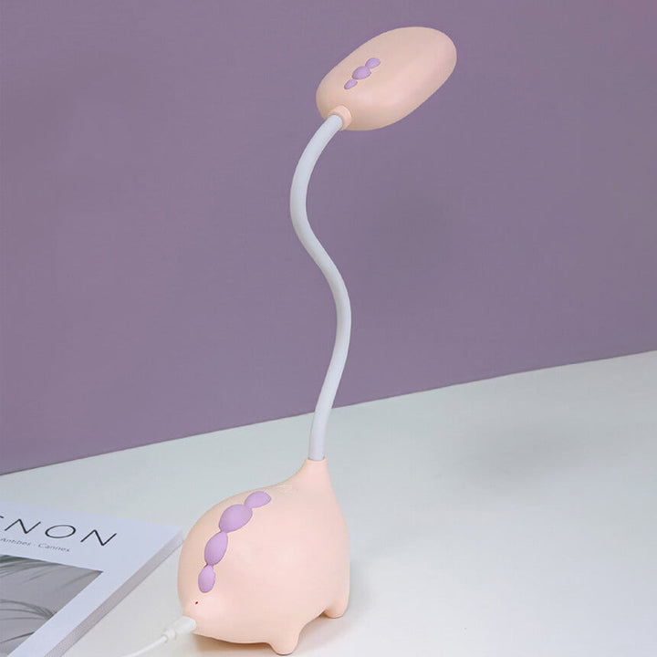 Sandsberg LED-bordlampe i dinosaurform, øjenvenlig, genopladelig, ideel til børneværelset.
