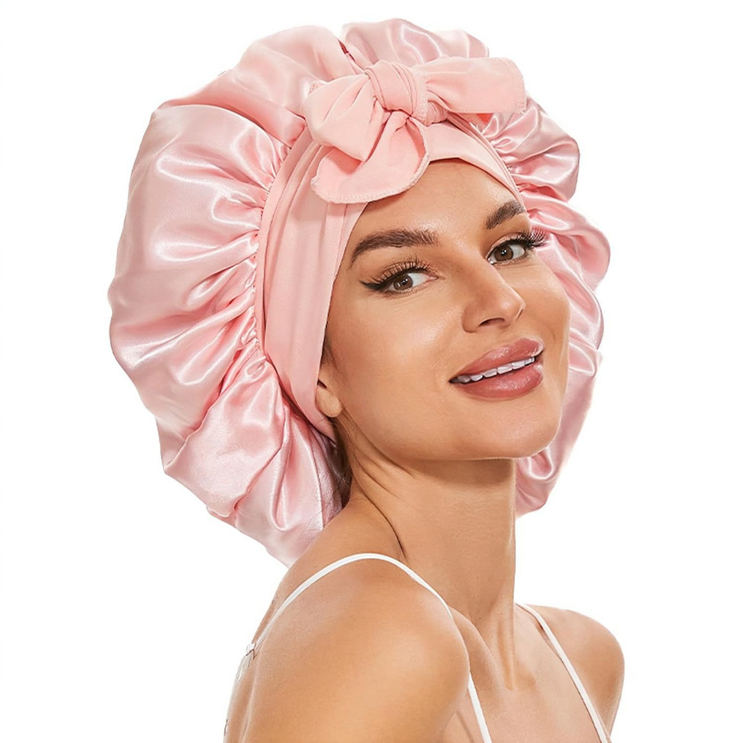 Silke sovehætte til hårpleje, der sikrer frizzfrit hår og luksuriøs sovekomfort, med et stilfuldt design.