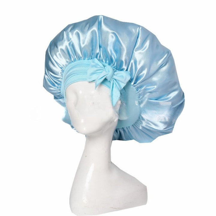 Silke sovehætte til hårpleje, der sikrer frizzfrit hår og luksuriøs sovekomfort, med et stilfuldt design.