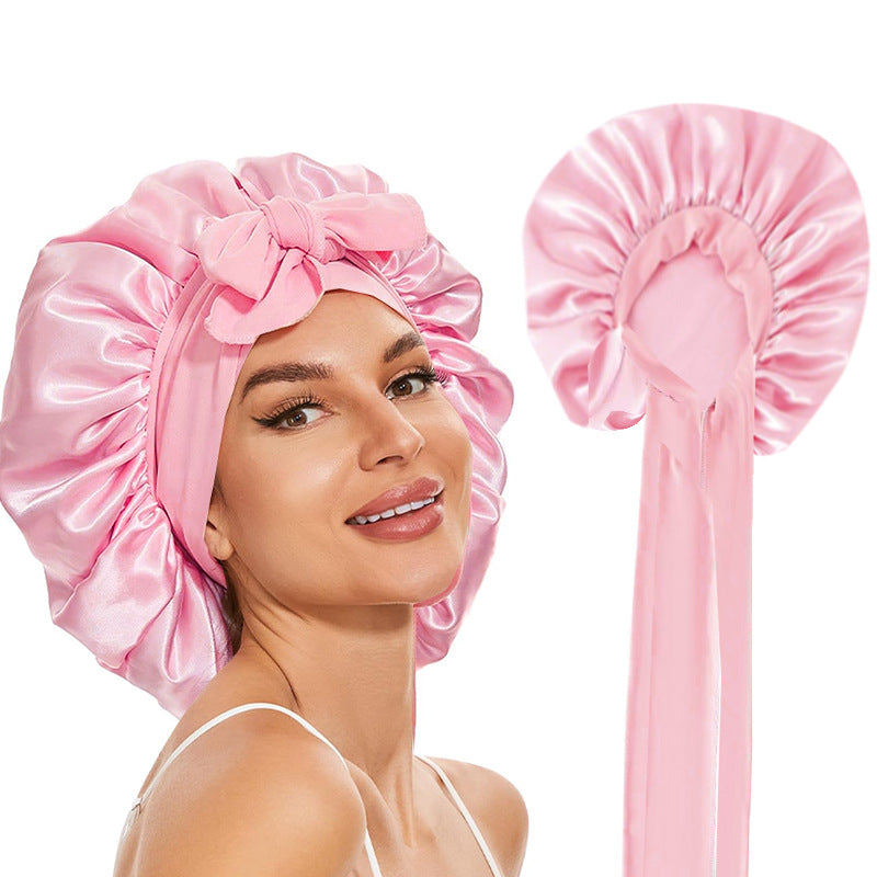 Silke sovehætte til hårpleje, der sikrer frizzfrit hår og luksuriøs sovekomfort, med et stilfuldt design.