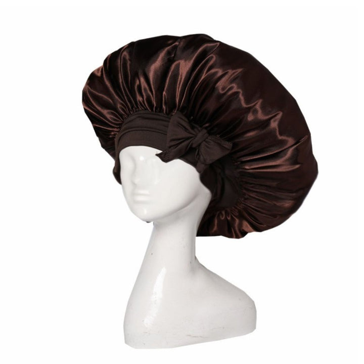 Silke sovehætte til hårpleje, der sikrer frizzfrit hår og luksuriøs sovekomfort, med et stilfuldt design.