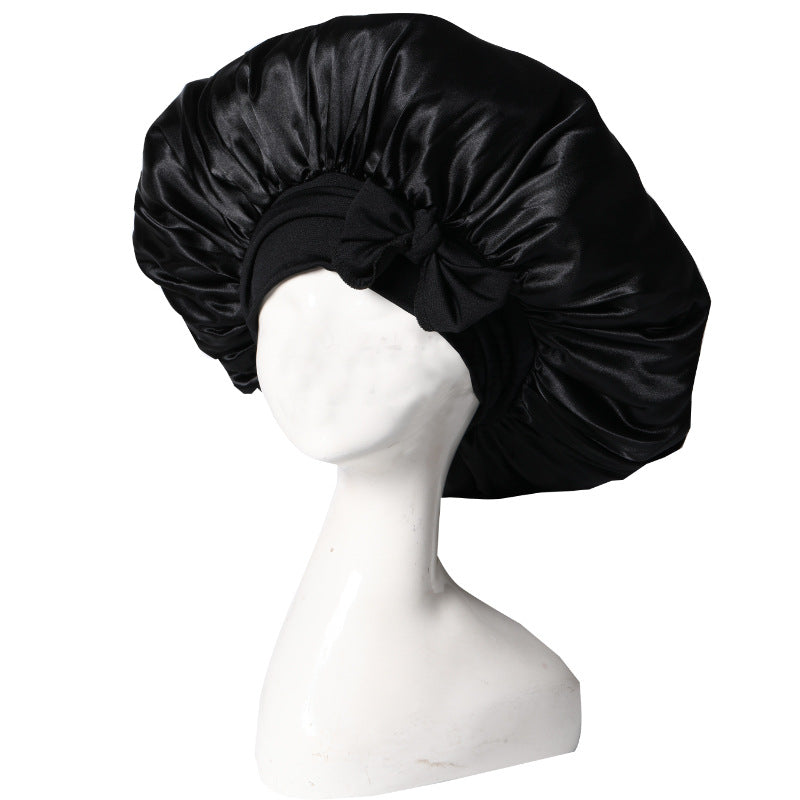 Silke sovehætte til hårpleje, der sikrer frizzfrit hår og luksuriøs sovekomfort, med et stilfuldt design.