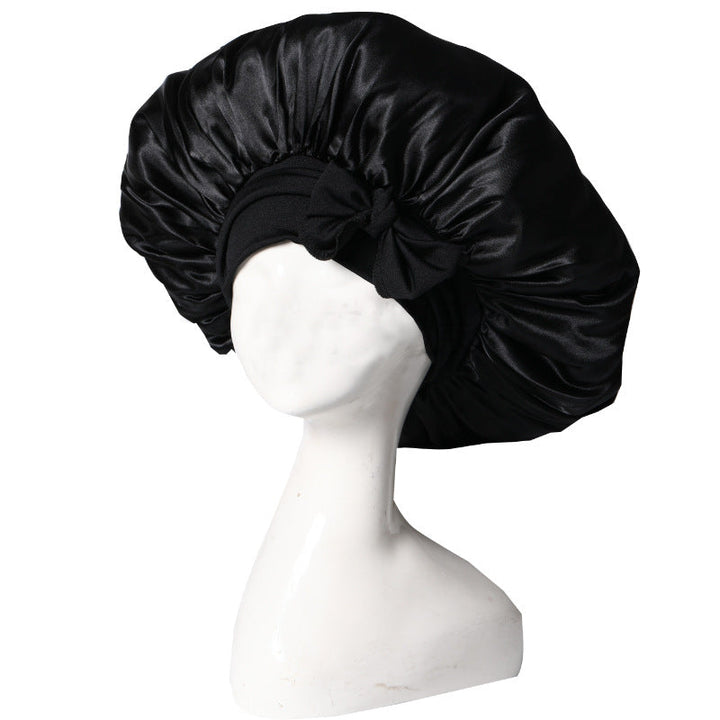 Silke sovehætte til hårpleje, der sikrer frizzfrit hår og luksuriøs sovekomfort, med et stilfuldt design.