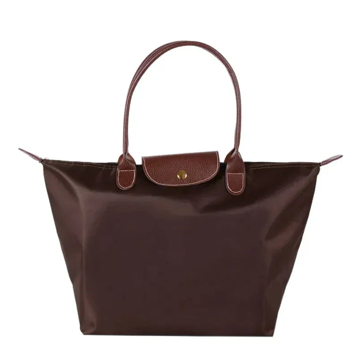 Alsidig dame shopper håndtaske. Trendy og funktionel hverdagstaske, der passer til alle outfits.