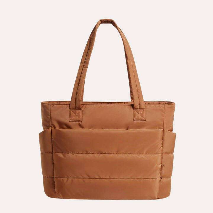 Polstret rejsetaske til kvinder, designet til at bære alt dit essentielle med stil.