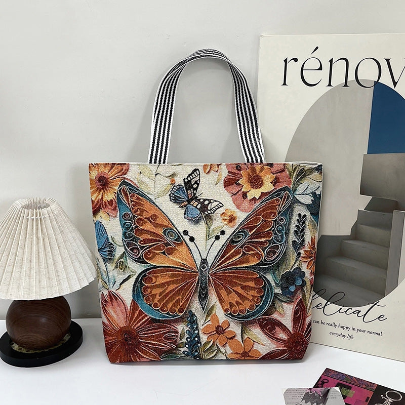 Moderigtig dame tote taske med broderi og struktureret design til shopping eller fritid.