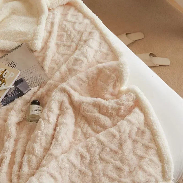 Lammeuldsdyne i fleece, tyk og varm. Et skønt hyggetæppe til vinteraftener.