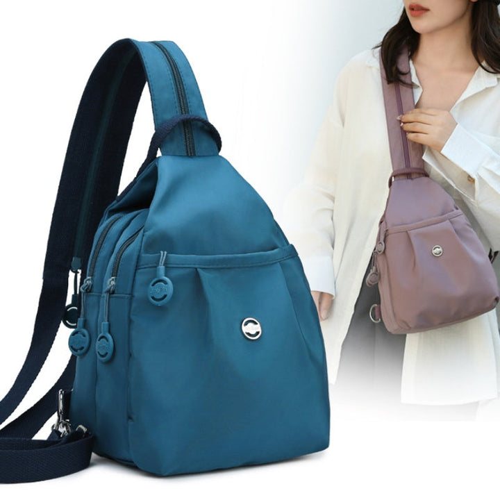Unisex konvertibel rygsæk/crossbody af slidstærkt oxfordstof. Alsidig rejse- og hverdagstaske med organiseret rum.