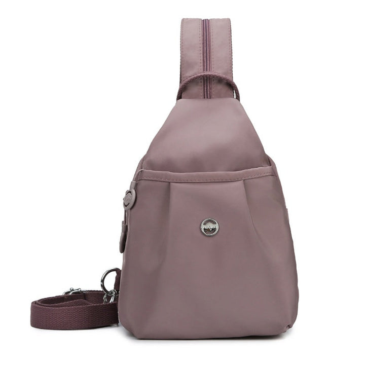 Konvertibel taske i oxfordstof med mange lynlåslommer for organiseret opbevaring. Rygsæk, skuldertaske, crossbody.