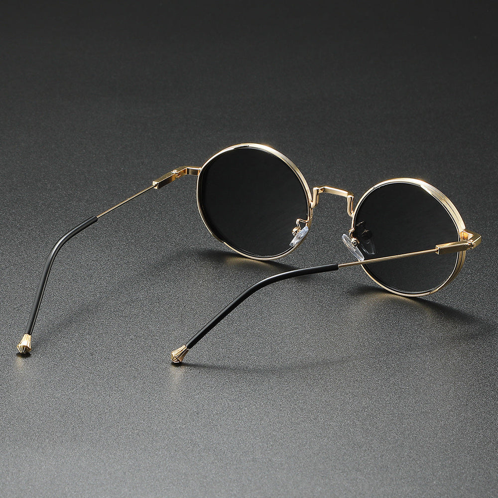 Elegante runde modesolbriller i metal, unisex design, med fuld UV400 beskyttelse mod solen.