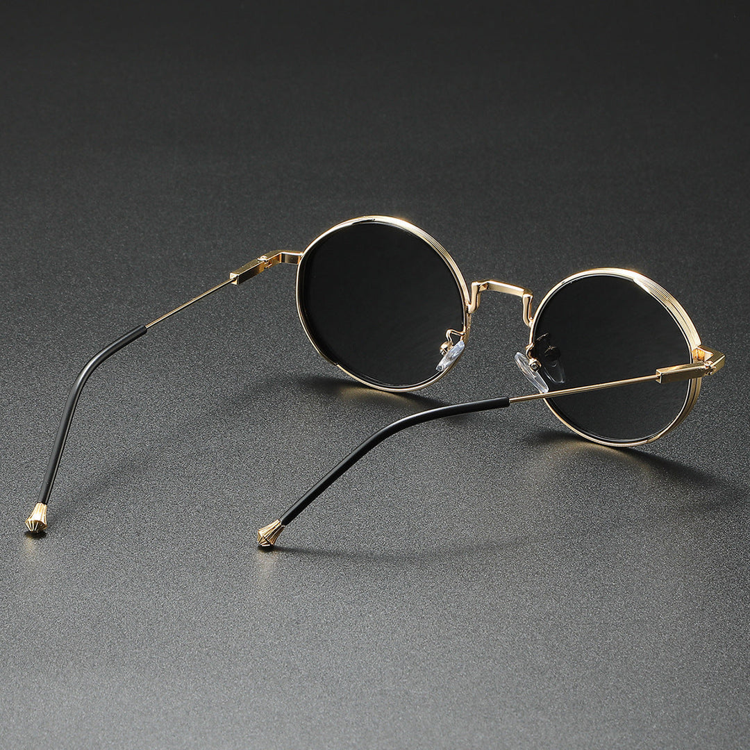 Elegante runde modesolbriller i metal, unisex design, med fuld UV400 beskyttelse mod solen.