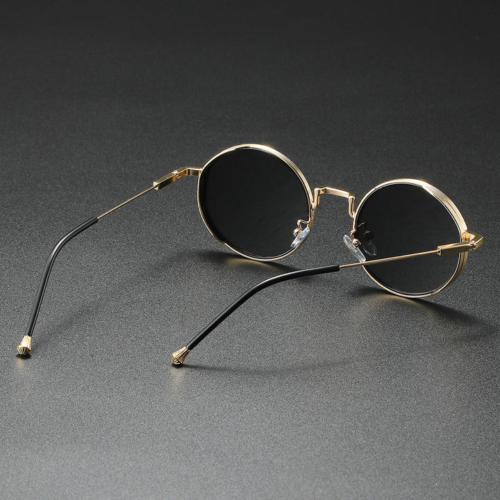 Elegante runde modesolbriller i metal, unisex design, med fuld UV400 beskyttelse mod solen.