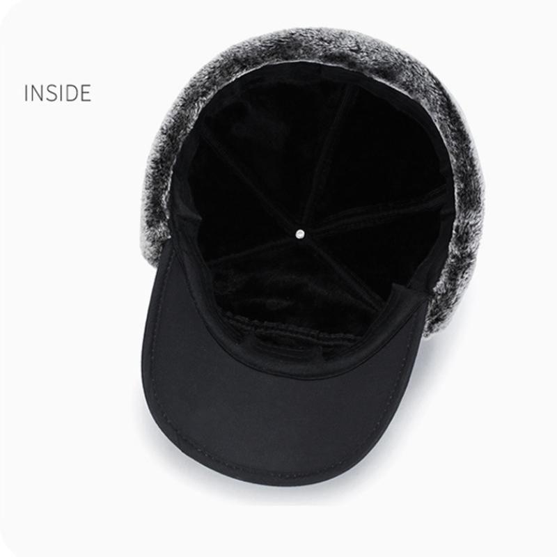 Polyester vinterhue med imiteret pels, vindtæt design, øreklapper og ansigtsmaske.