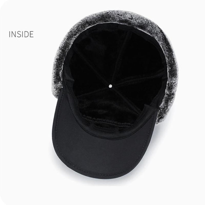 Polyester vinterhue med imiteret pels, vindtæt design, øreklapper og ansigtsmaske.