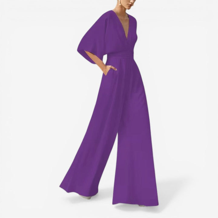 Dame jumpsuit til sommer: løs pasform, stilfuld V-hals og behagelig for hverdagsbrug.