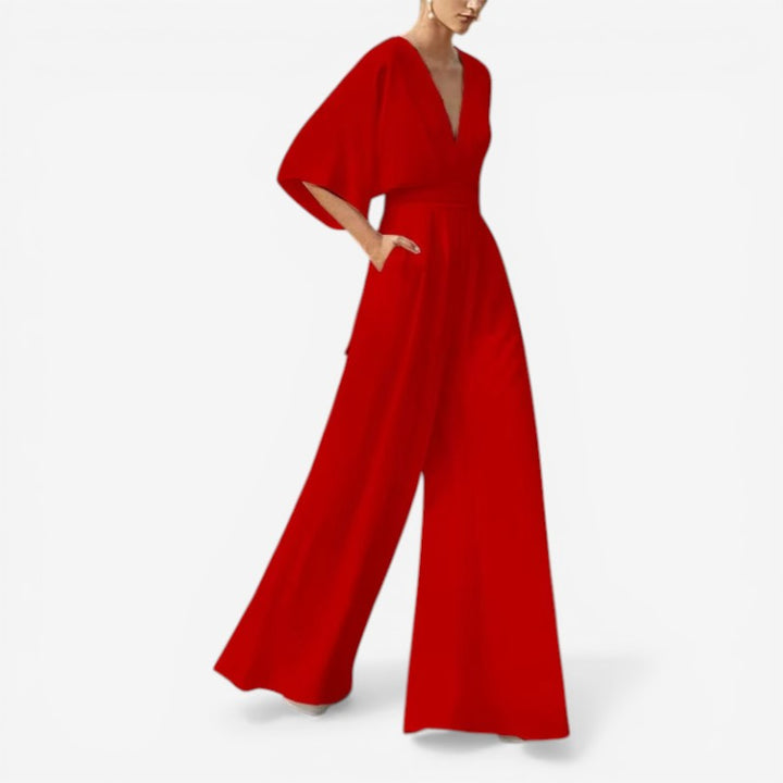 Ensfarvet dame jumpsuit, løs pasform og V-hals for en elegant, men afslappet stil.