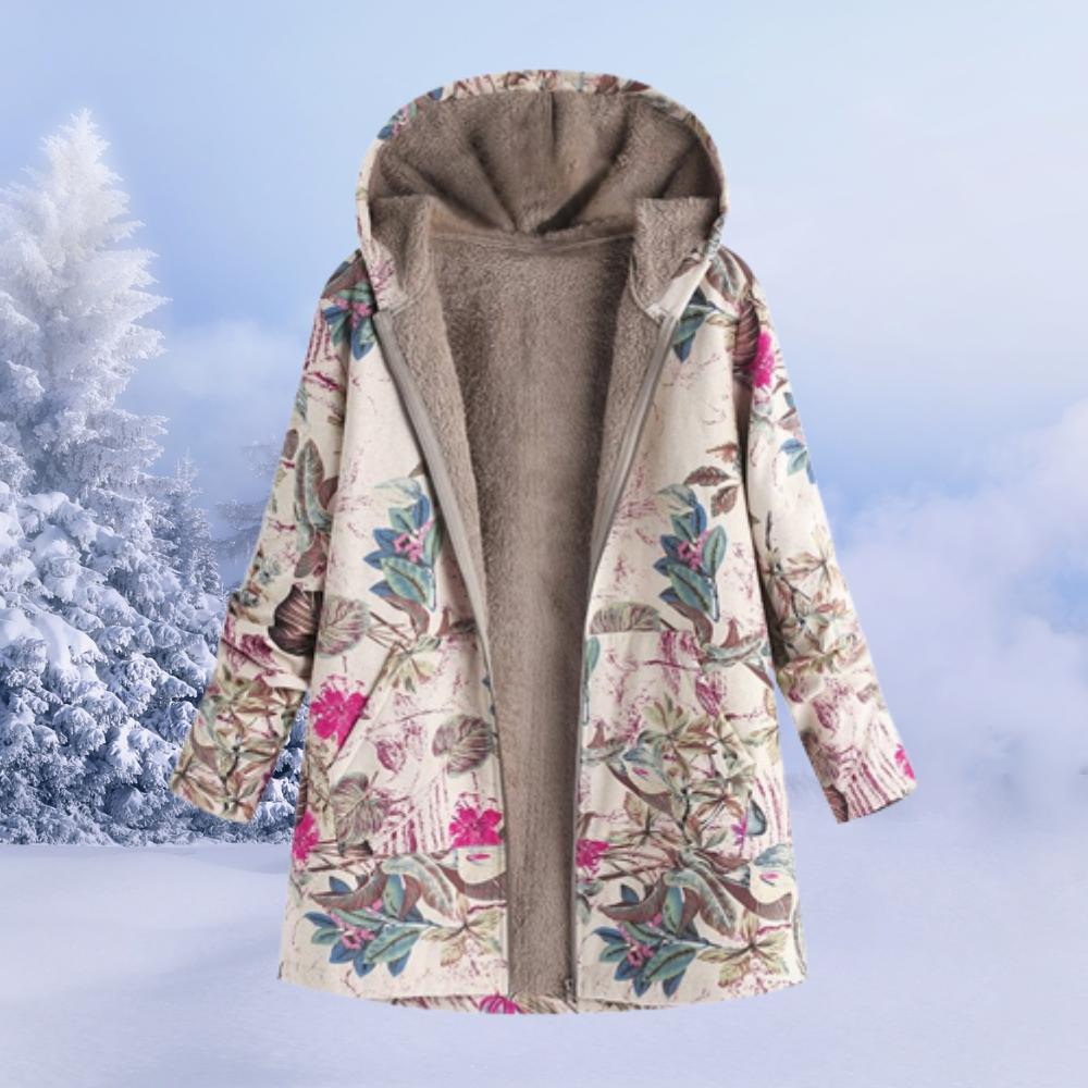Elegant kvinders blomstrede vinterjakke, lang model. Varm, farverig og modebevidst ydertøj til dame.