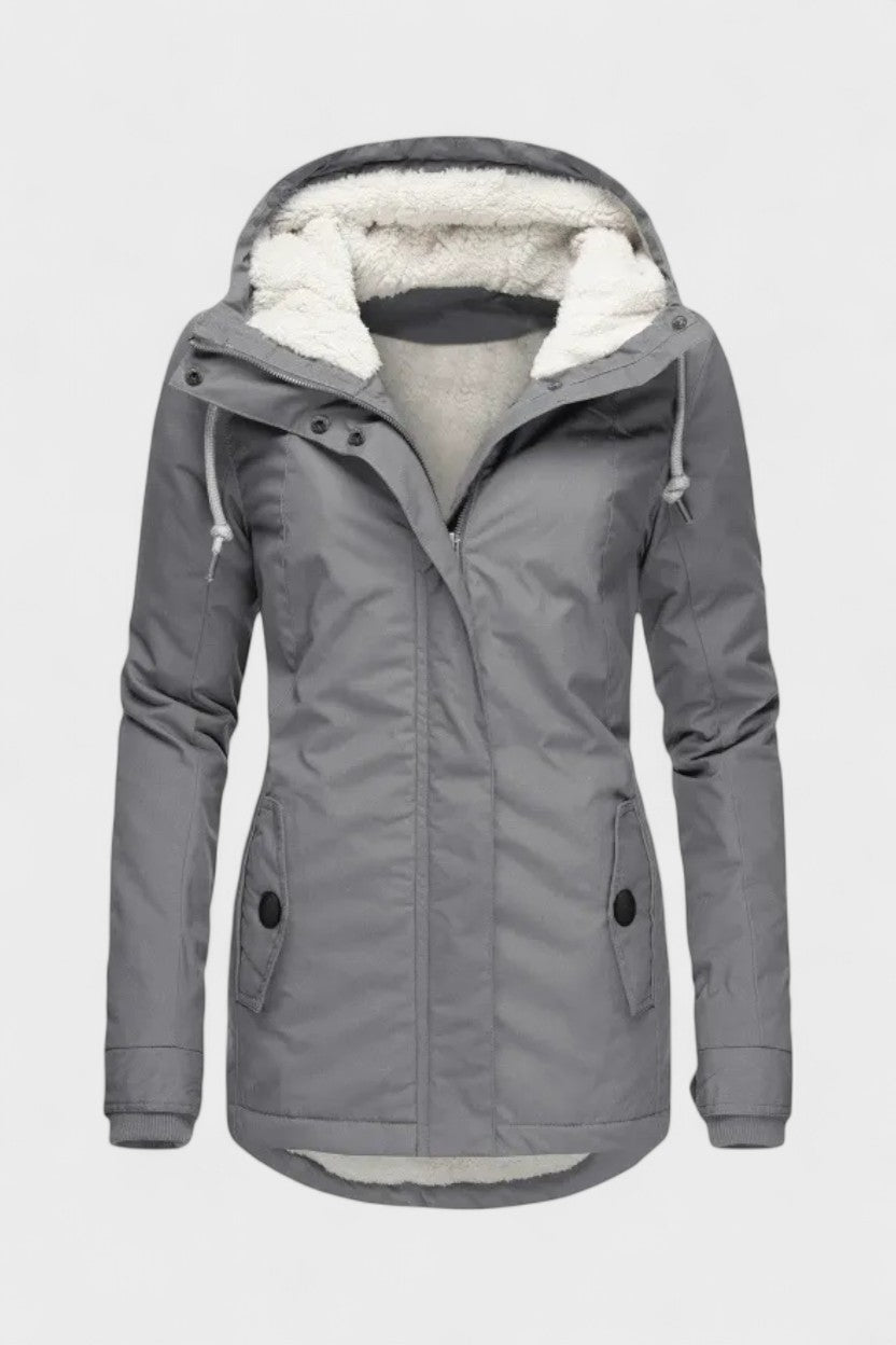Elegant vinterjakke til kvinder med foret inderside. Ideel til koldt vejr og outdoor-aktiviteter.
