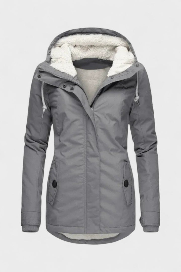 Elegant vinterjakke til kvinder med foret inderside. Ideel til koldt vejr og outdoor-aktiviteter.