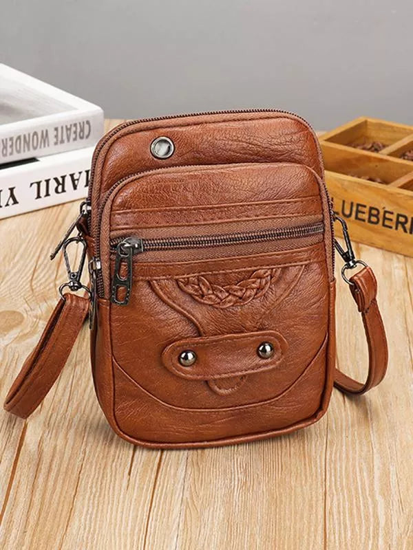 Vintage brun crossbody-taske i PU-læder til kvinder. Elegant og praktisk dametaske, perfekt til hverdagsbrug.