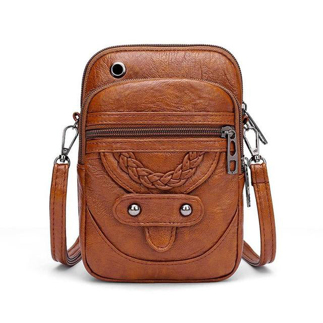 Elegant PU-læder crossbody-taske til kvinder. Praktisk sort skuldertaske med vintage look.