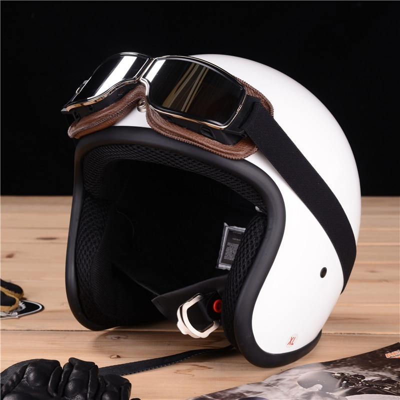 Vintage læder-motorcykelbrille i retro-stil med splintfri glas, der beskytter mod vind og støv, stilfuld og robust.