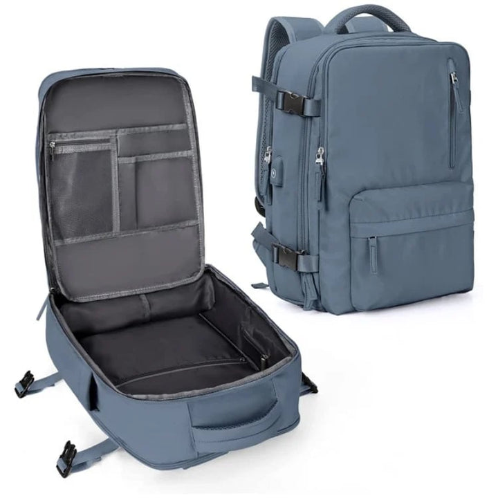 Vandtæt damerejserygsæk med USB-port, 35L volumen, i blå med polstrede stropper og sikkerhedsrum.
