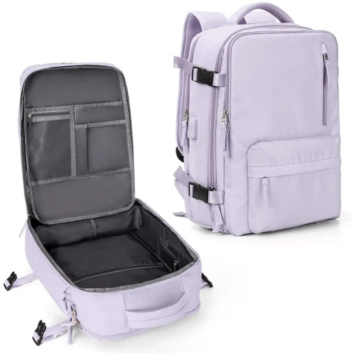 Vandtæt damerejserygsæk med USB-port, 35L volumen, i blå med polstrede stropper og sikkerhedsrum.