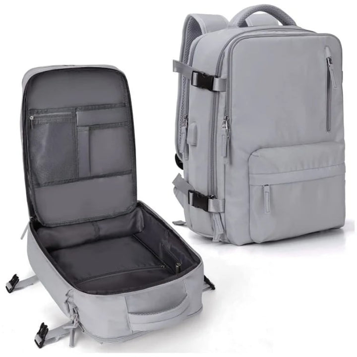 Vandtæt damerejserygsæk med USB-port, 35L volumen, i blå med polstrede stropper og sikkerhedsrum.