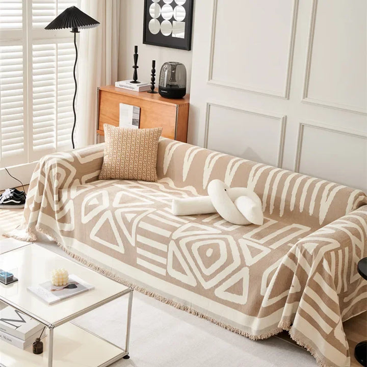 Boheme-inspireret sofatæppe i chenille-materiale, perfekt til at opgradere din stue.